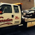 Flatbed tow truck providing tow truck service Ottawa for damaged vehicles
