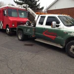 Local Ottawa tow truck service by Canadian Towing assisting a broken-down car