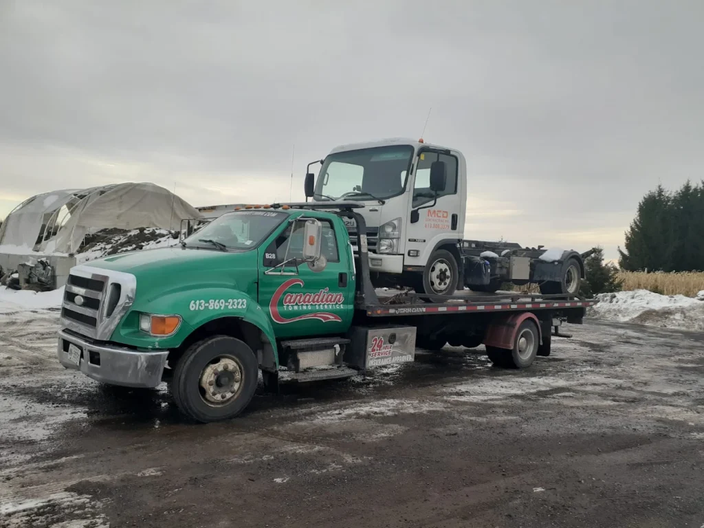 Canadian Towing performing heavy-duty towing in Ottawa with a commercial wrecker recovering a large truck