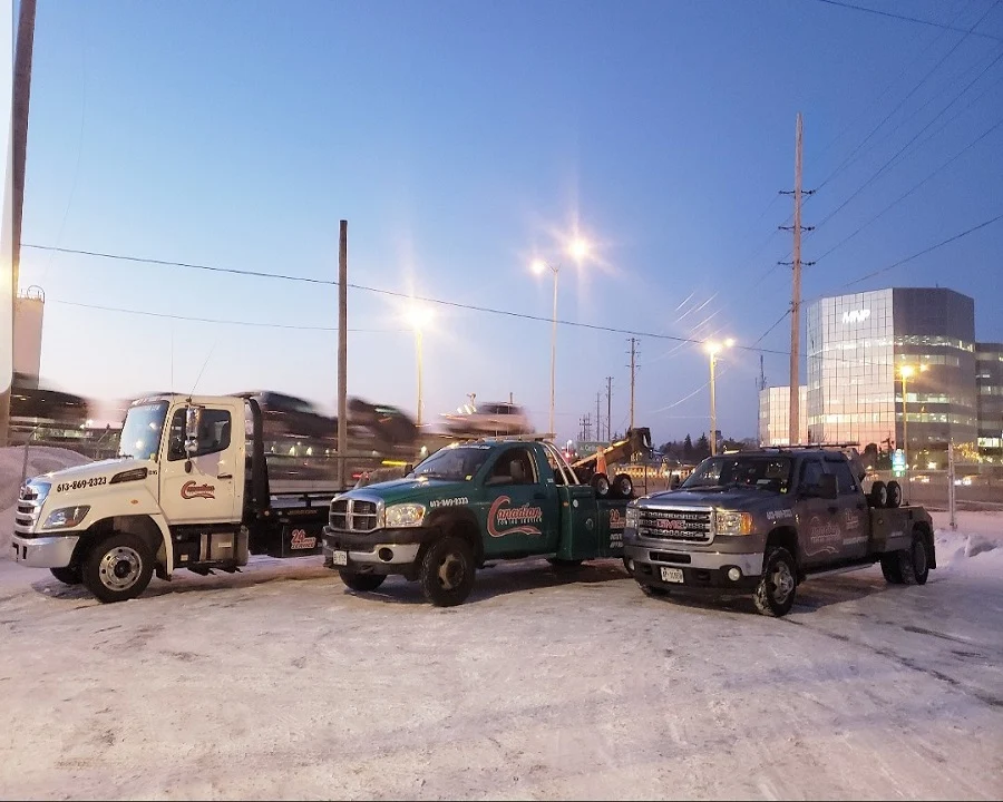 Canadian Towing transporting a disabled vehicle to a specific repair shop in Ottawa with insurance-approved towing service